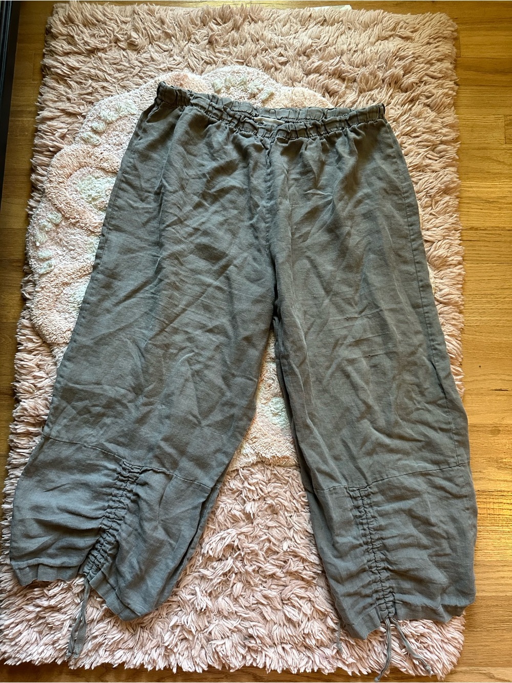 Bryn Walker linen pants with cinching ties at the bottom hem